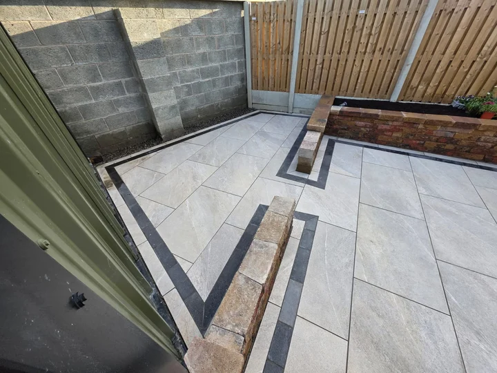 Porcelain paving and contrasting borders at the corner of the raised bed.