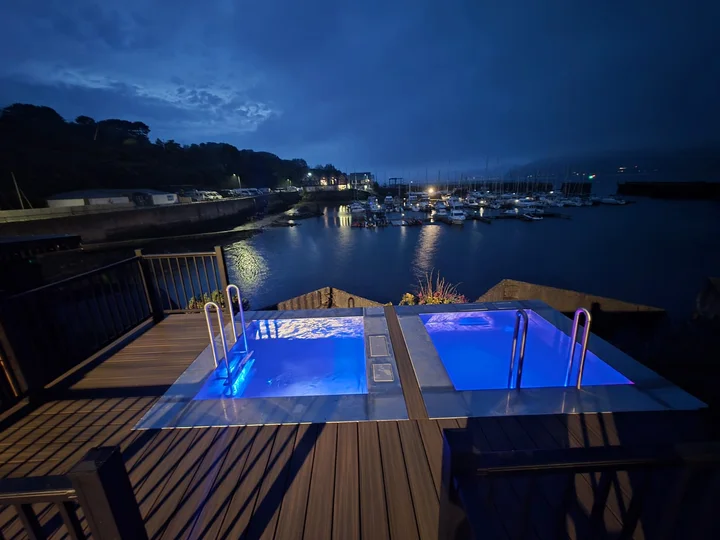 The pools and waterfront after dark.
