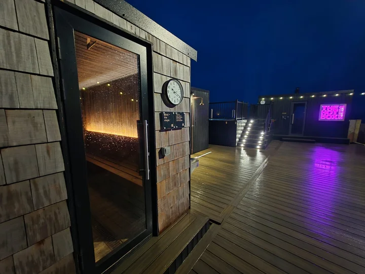 The sauna entrance opens directly onto the deck.