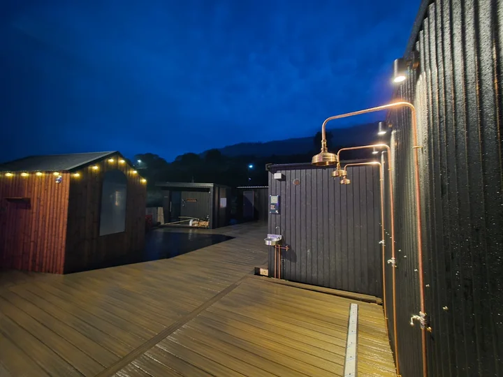 Deck boards connect the cabins and outdoor spaces.