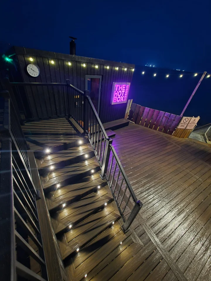 Recessed lighting follows the staircase.