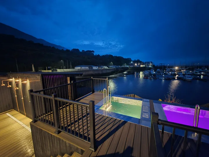 The deck overlooks the marina and surrounding hills.